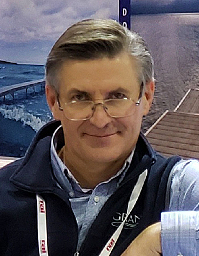 A man standing at a boat show